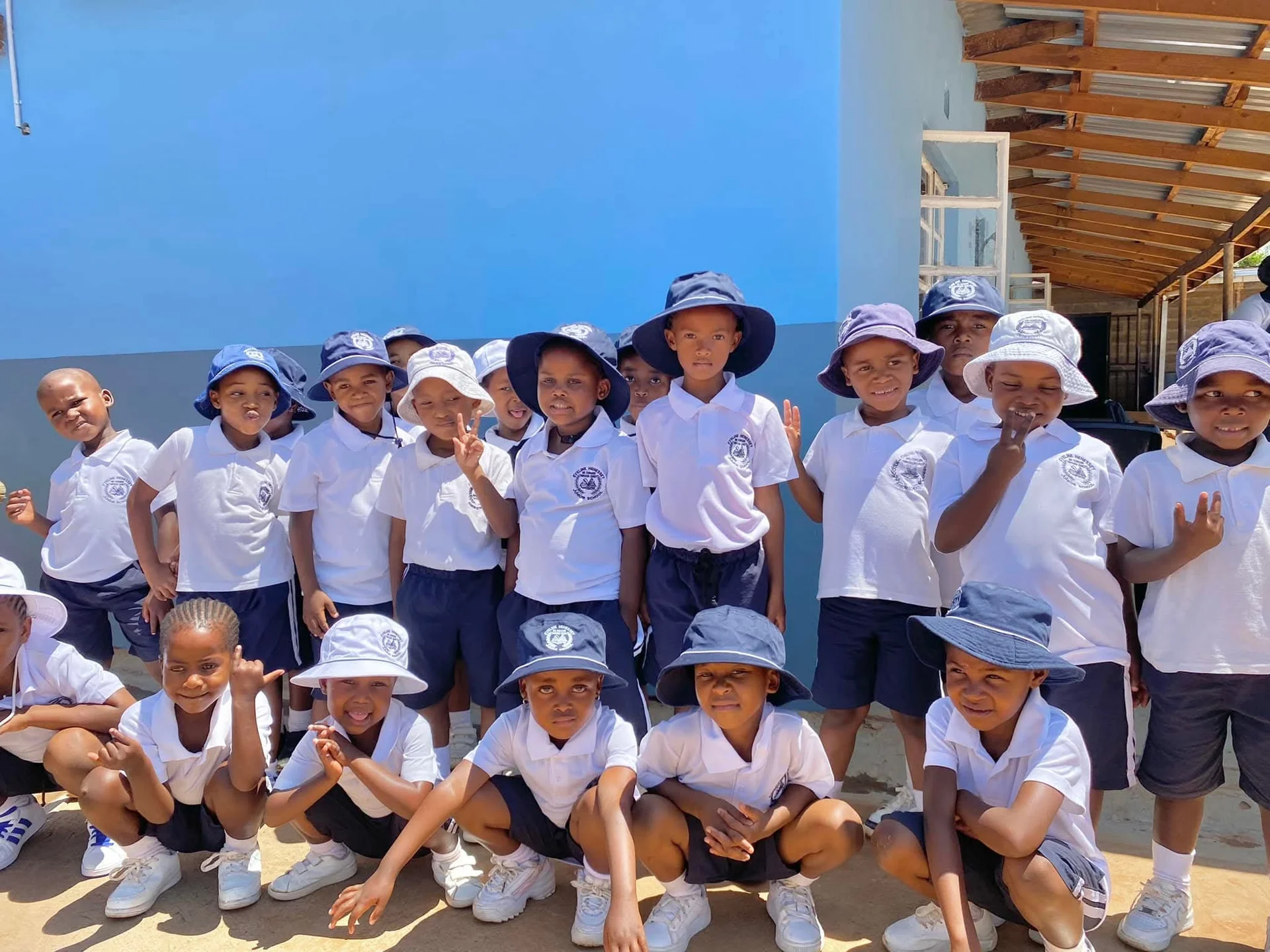 Primary school students studying attentively in a well-lit classroom