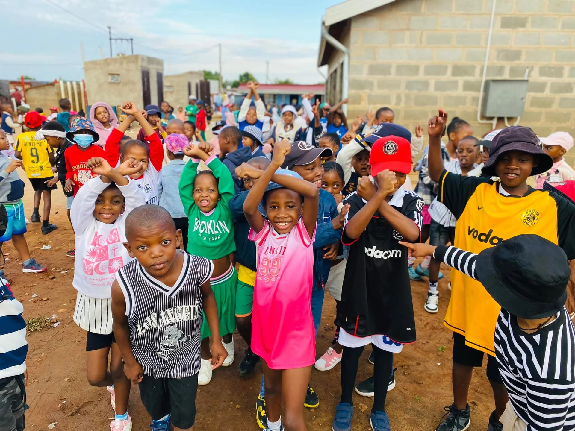 Community gathering at a school-hosted family fun day event